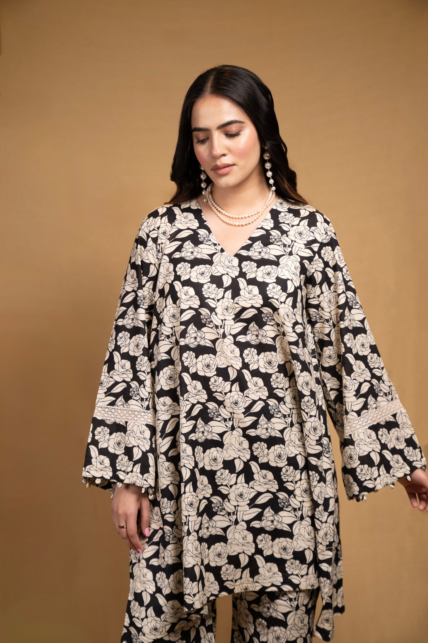 Black and off-white printed floral kurta with flared pants (Co-ord Set)